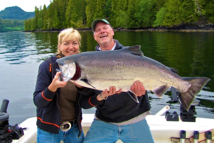 Fishermen pose with giant king salmon caught sport fishing in Ketchikan