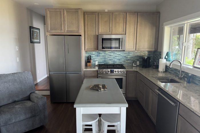 clean and modern kitchen inside a rental cabin at a fishing lodge in Knudson Cove Alaska